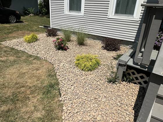 Stone path bed alongside a home in Akron, NY