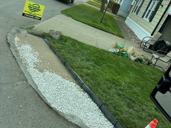 Stone edging installed along a driveway in Akron, NY
